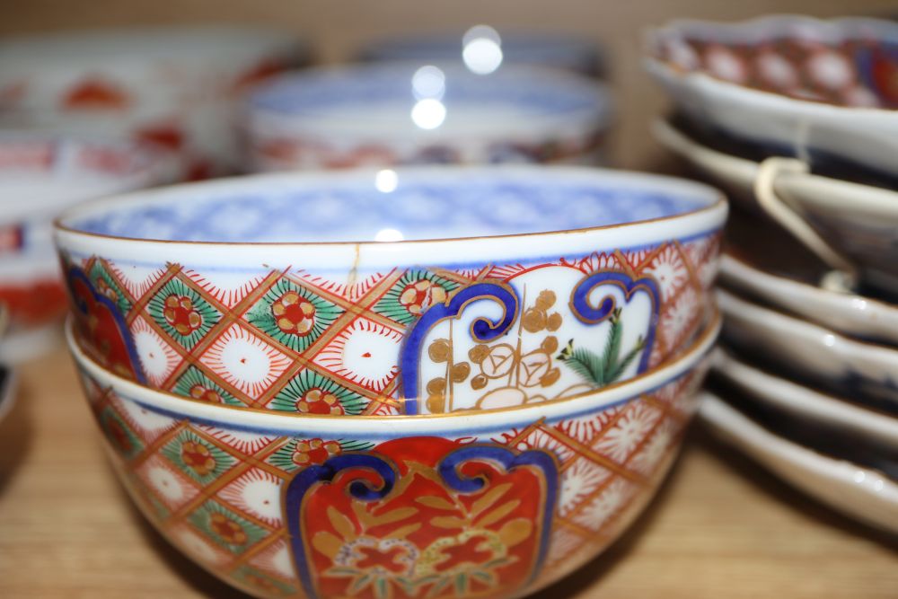 A group of Japanese Imari dishes and bowls, and a St Ives pottery vase